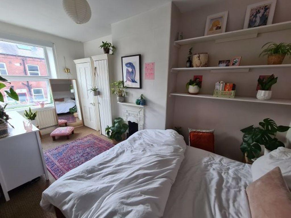 Bright and welcoming bedroom with ample natural...