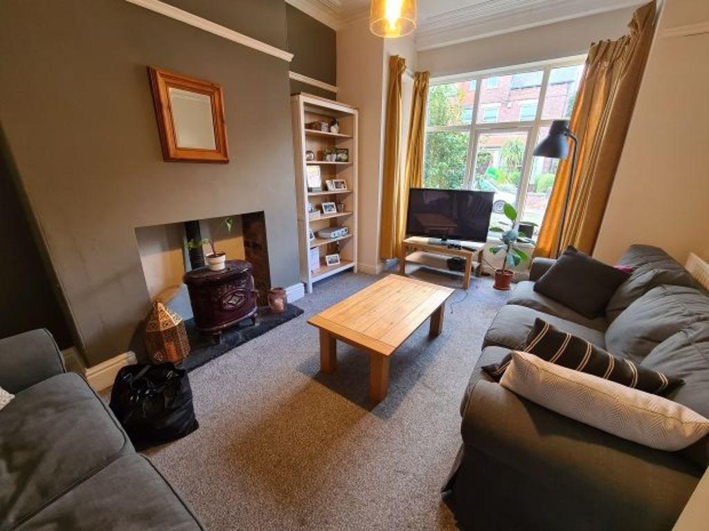 A bright, well-maintained living room featuring...