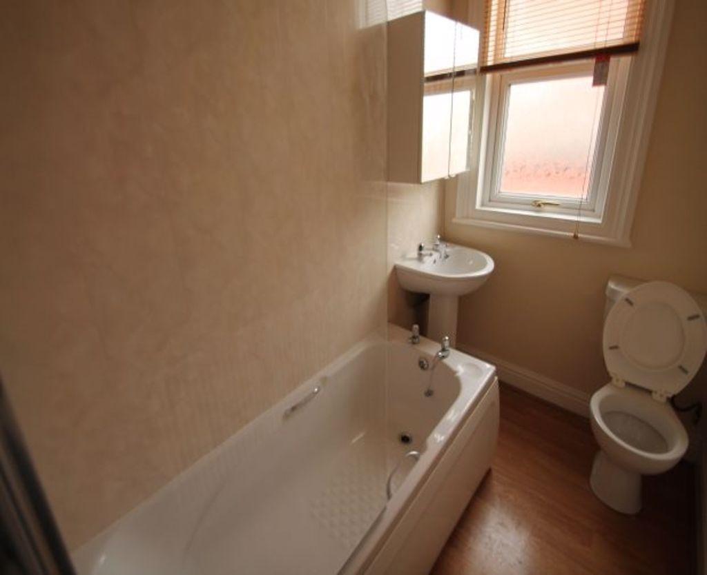 A clean and well-maintained bathroom featuring ...