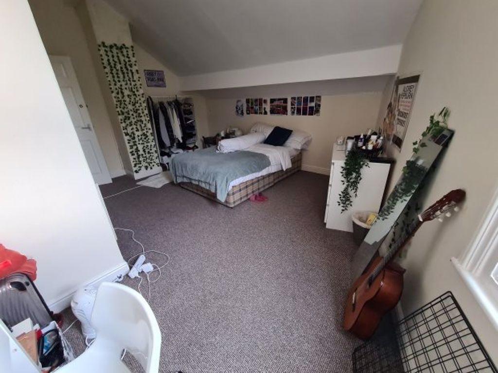 Spacious bedroom featuring a double bed with am...