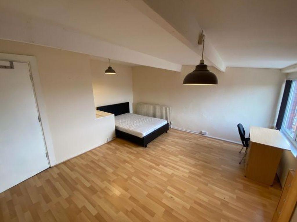 Bright and spacious living room with wooden flo...