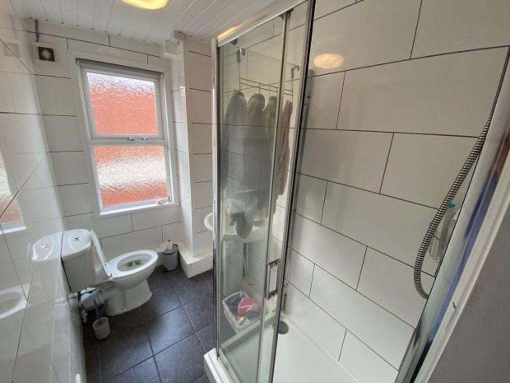 A clean and well-maintained bathroom with a sho...