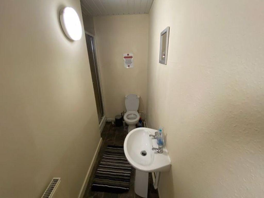 A clean and functional bathroom with a toilet a...