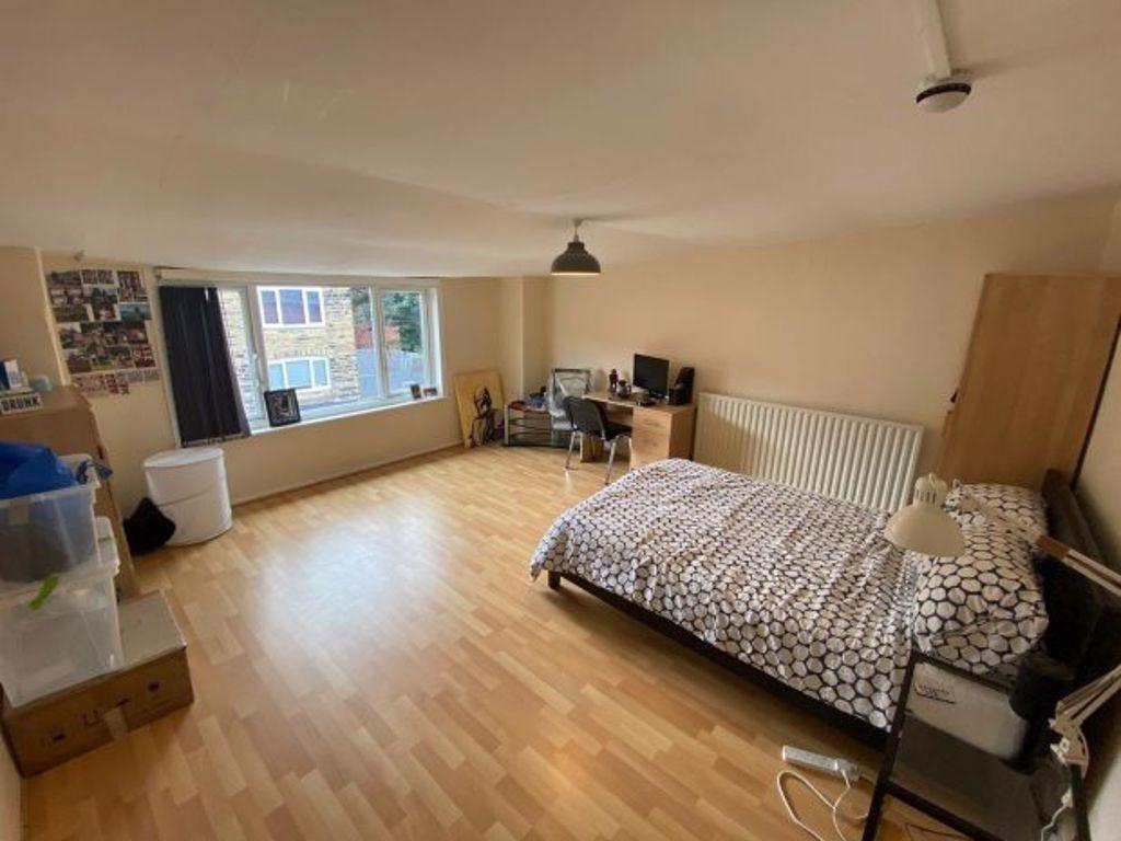 A bright and spacious living room with a large ...