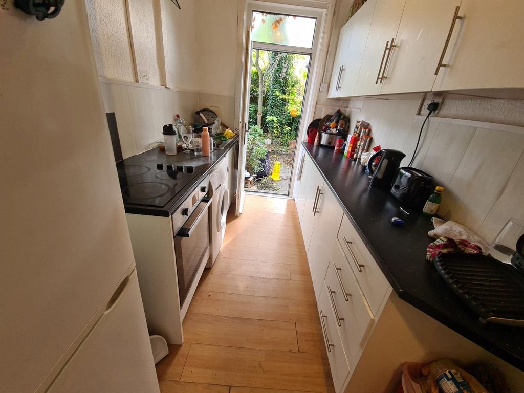 A bright and functional kitchen area with moder...