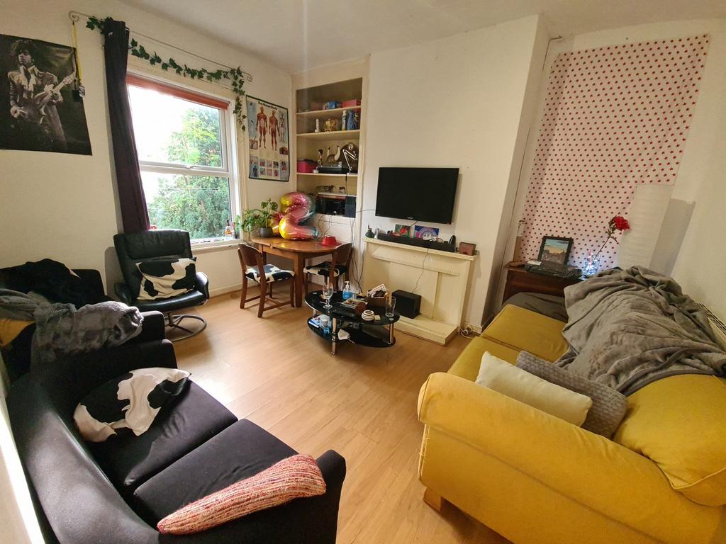 A bright and inviting living room featuring a m...