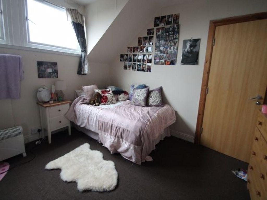A cozy bedroom featuring a double bed with deco...