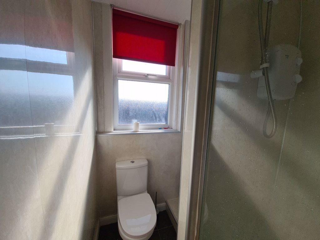 A clean, well-maintained bathroom featuring a w...