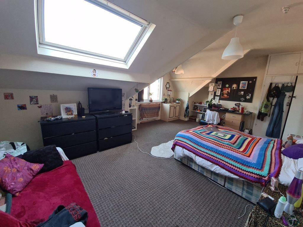Bright and cozy living room featuring a large w...