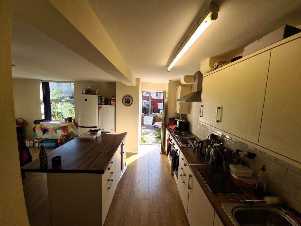 A bright and well-organized kitchen featuring m...