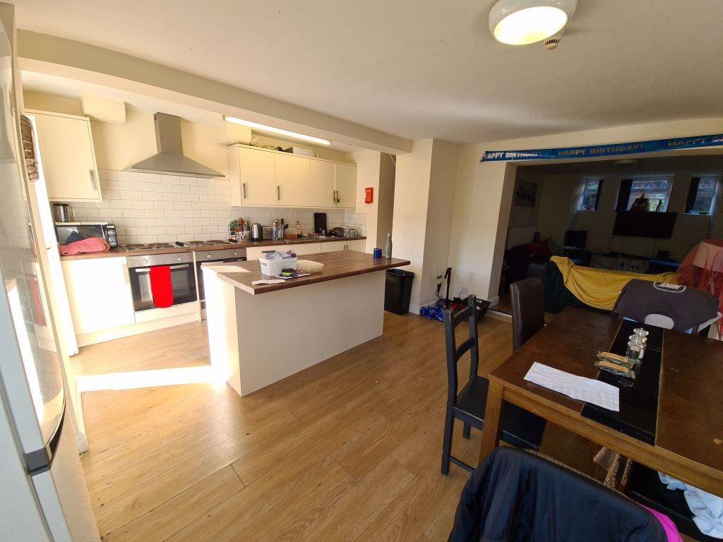 A spacious and welcoming living room featuring ...
