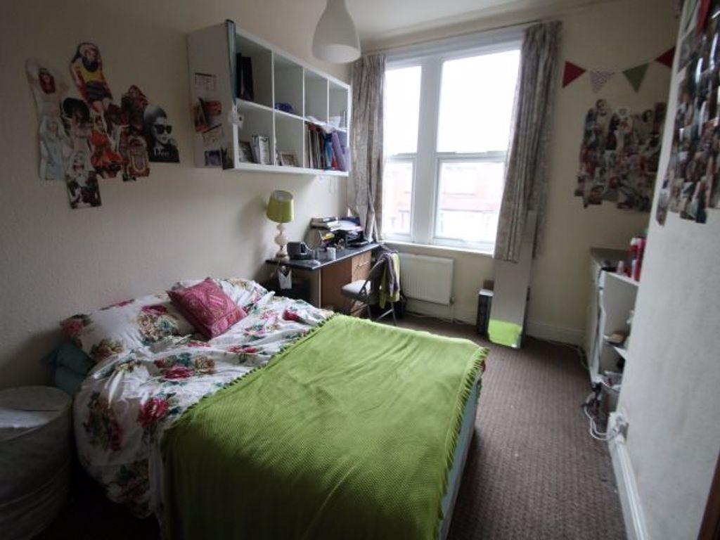 A bright and welcoming double bedroom featuring...