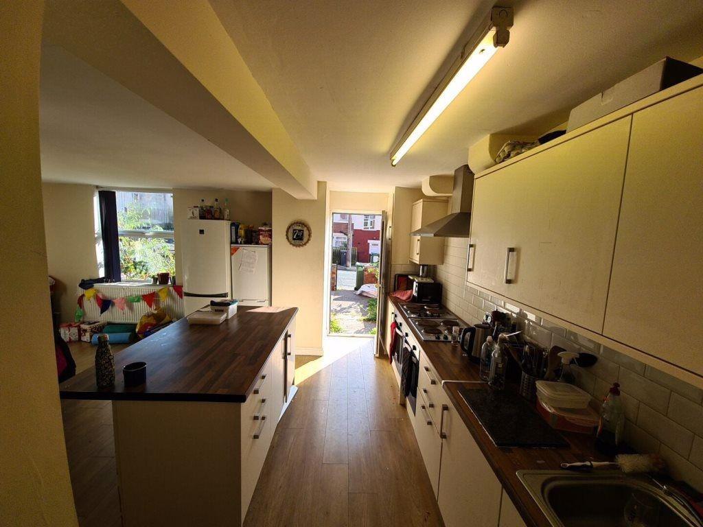 A bright and spacious living room with ample na...