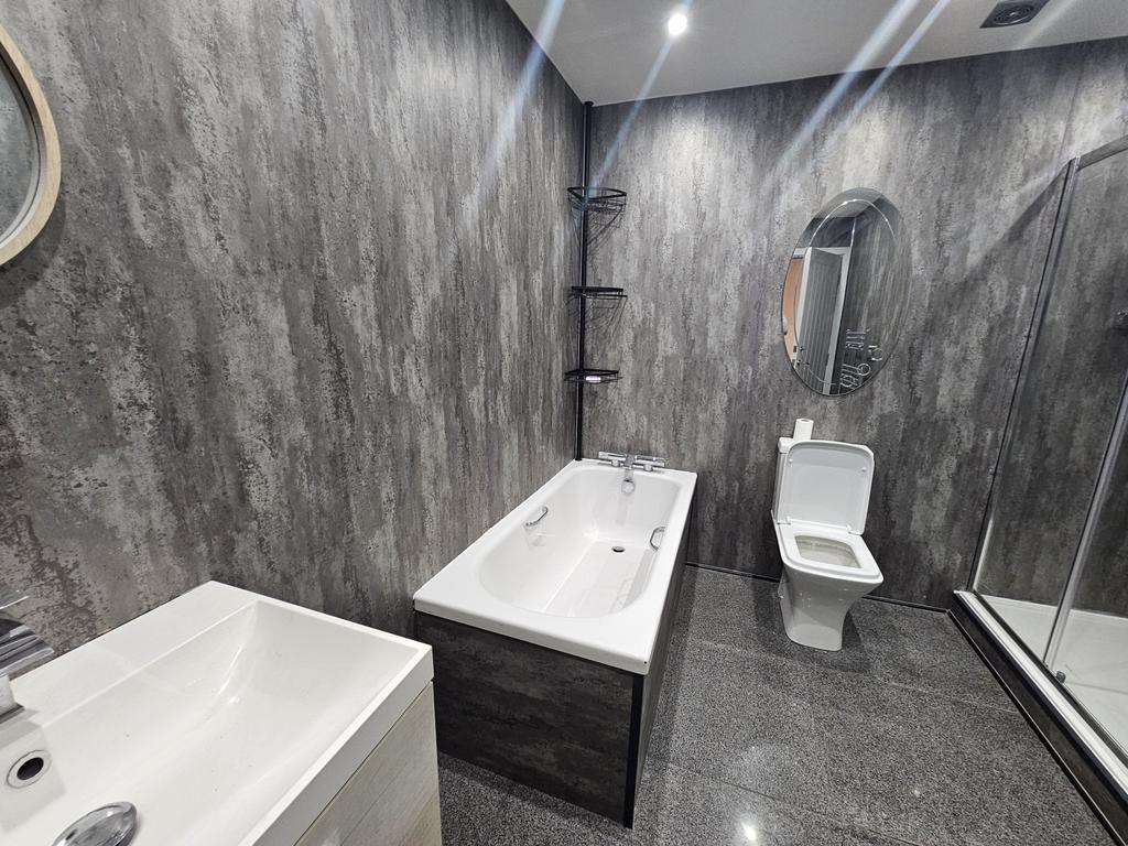 Modern and well-maintained bathroom featuring a...