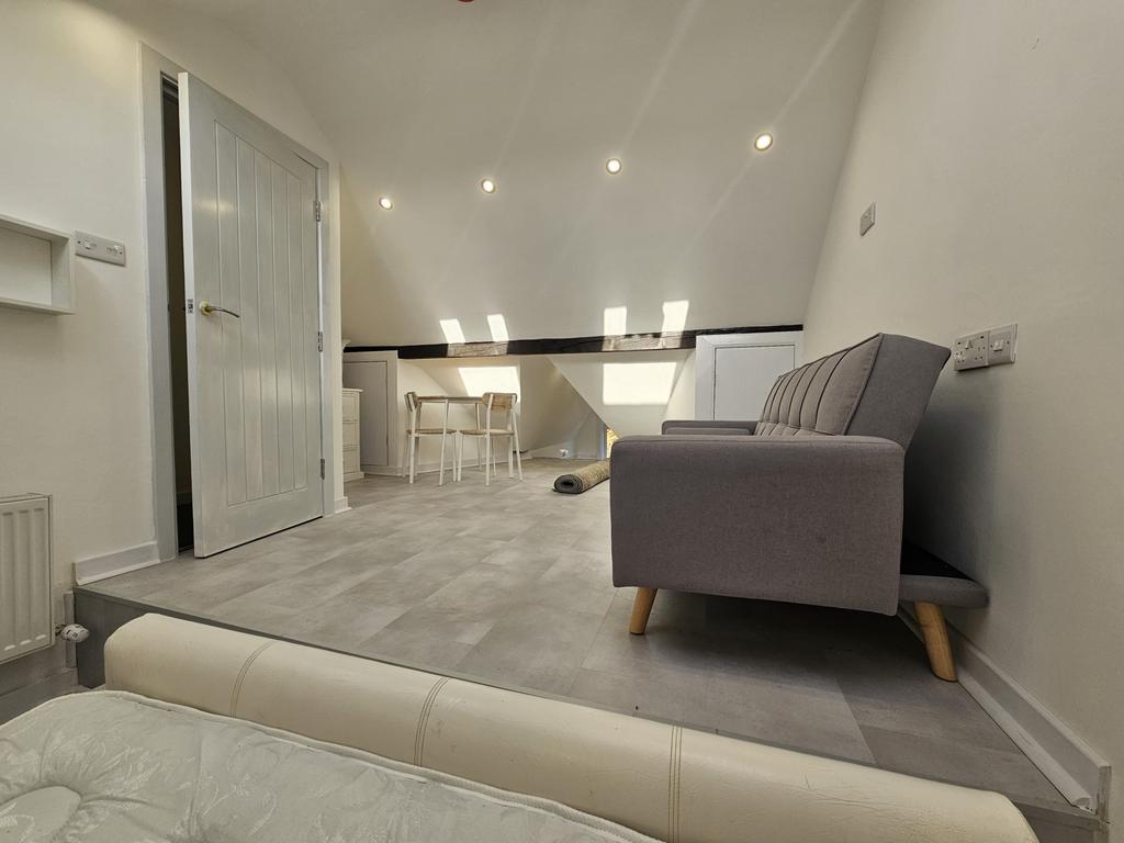 A modern and spacious living room featuring com...