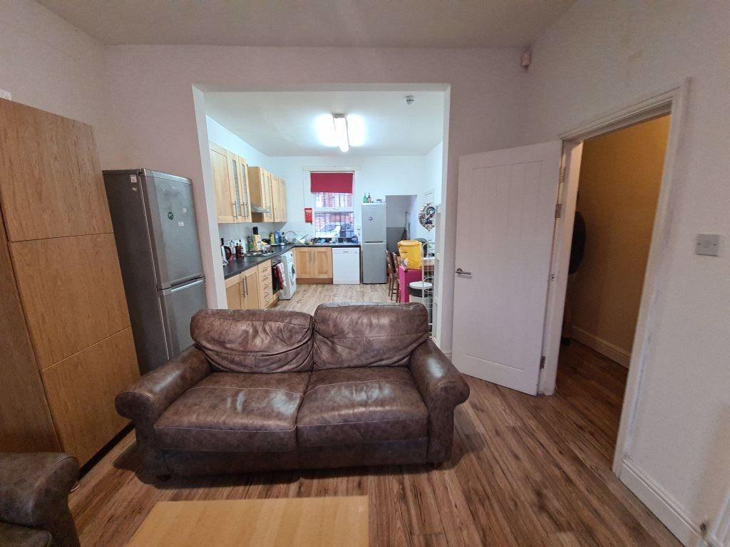 A cozy living room featuring a comfortable brow...