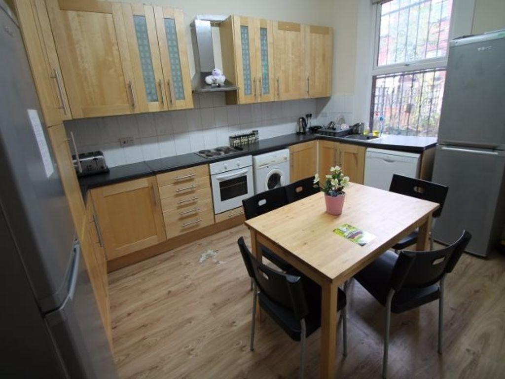 Bright and well-organized kitchen with natural ...