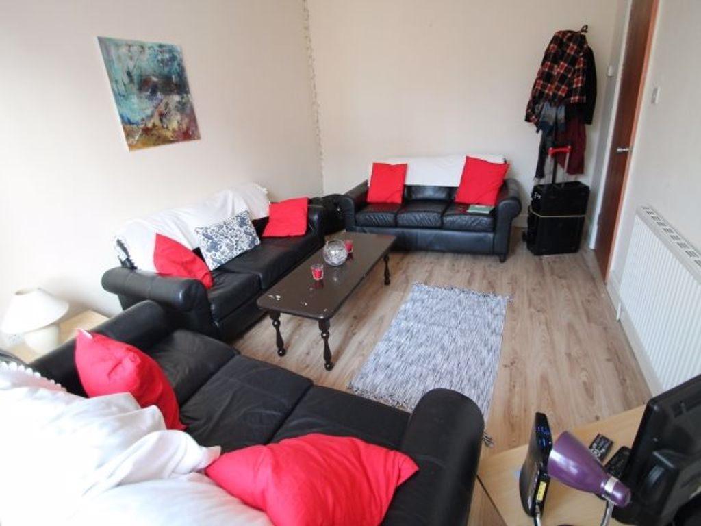 A spacious and stylish living room featuring a ...