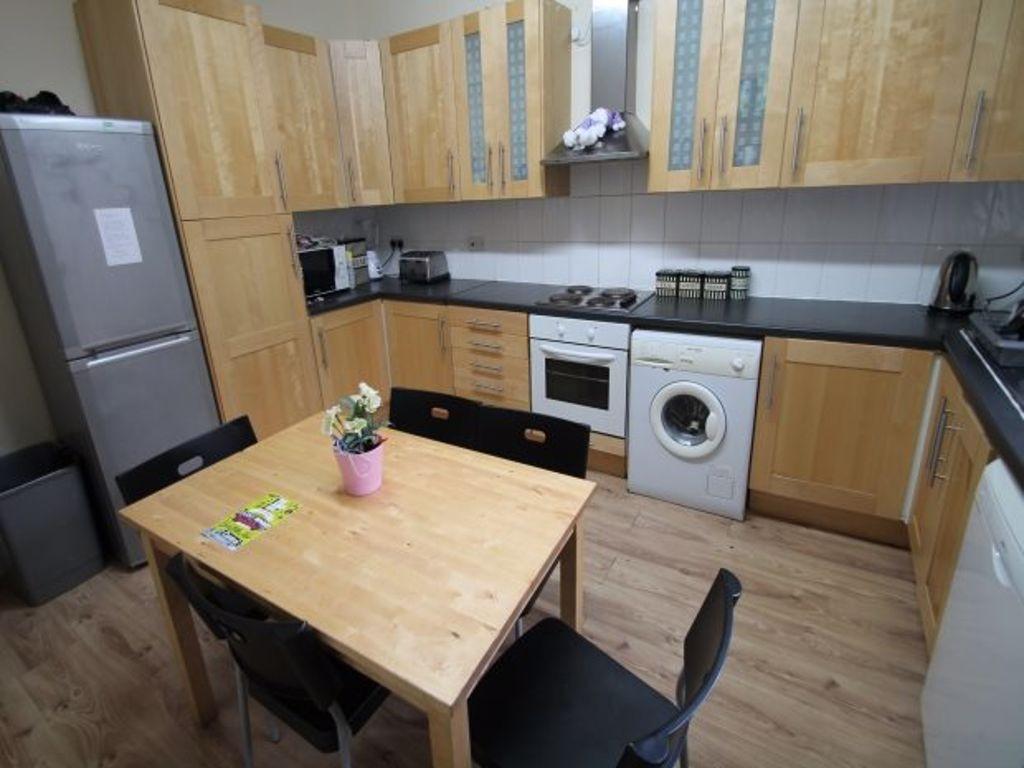 A modern, well-maintained kitchen featuring woo...