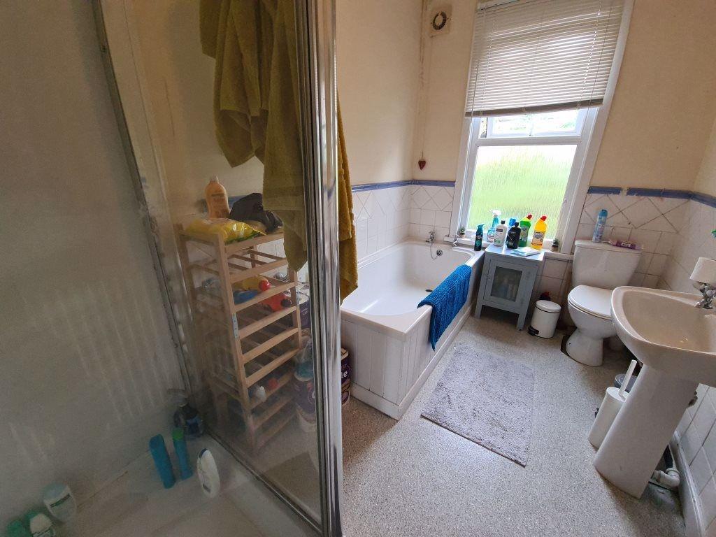 A bright and well-maintained bathroom featuring...