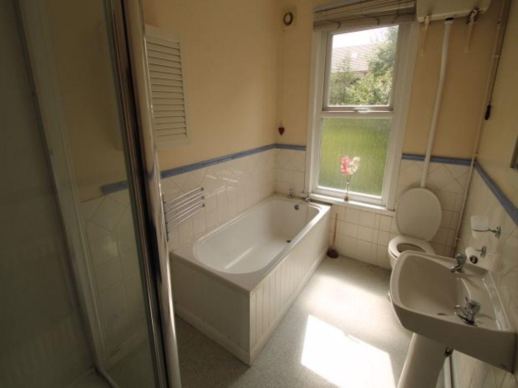 Bright and clean bathroom featuring a sizeable ...