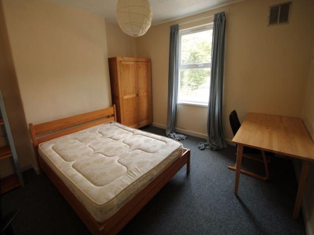 A welcoming double bedroom featuring a spacious...