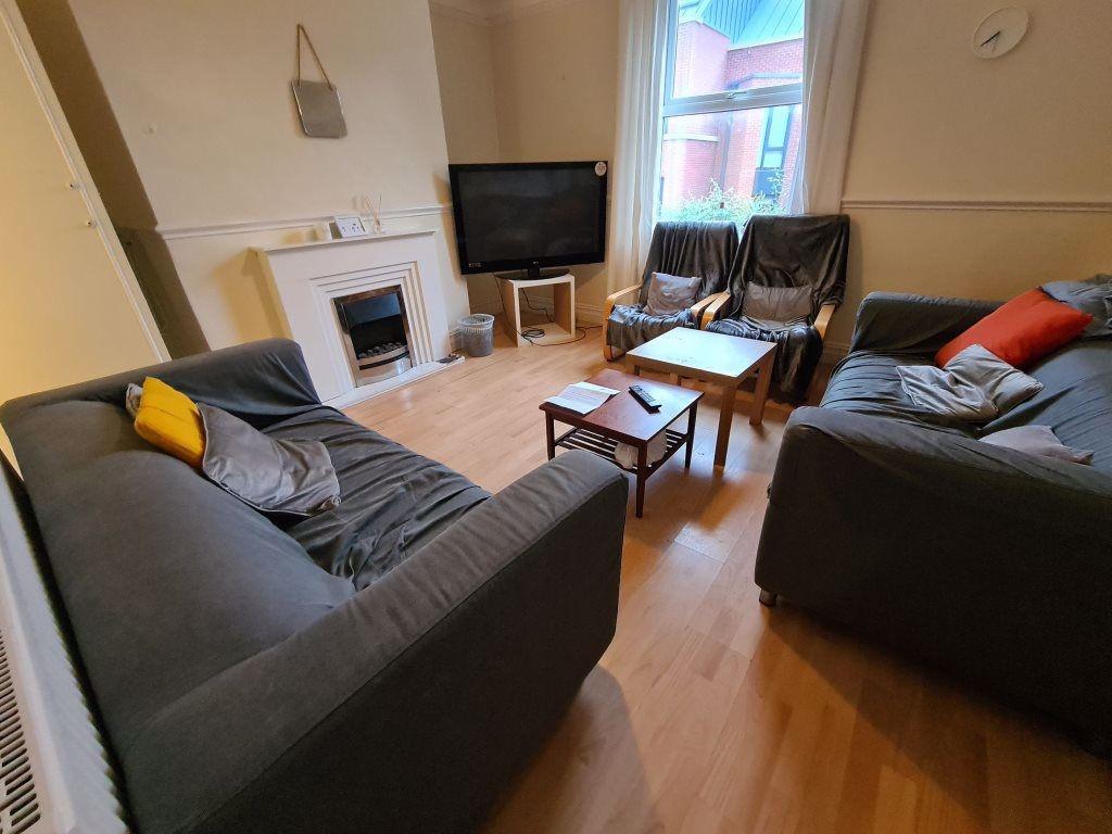 A spacious and well-lit contemporary living roo...