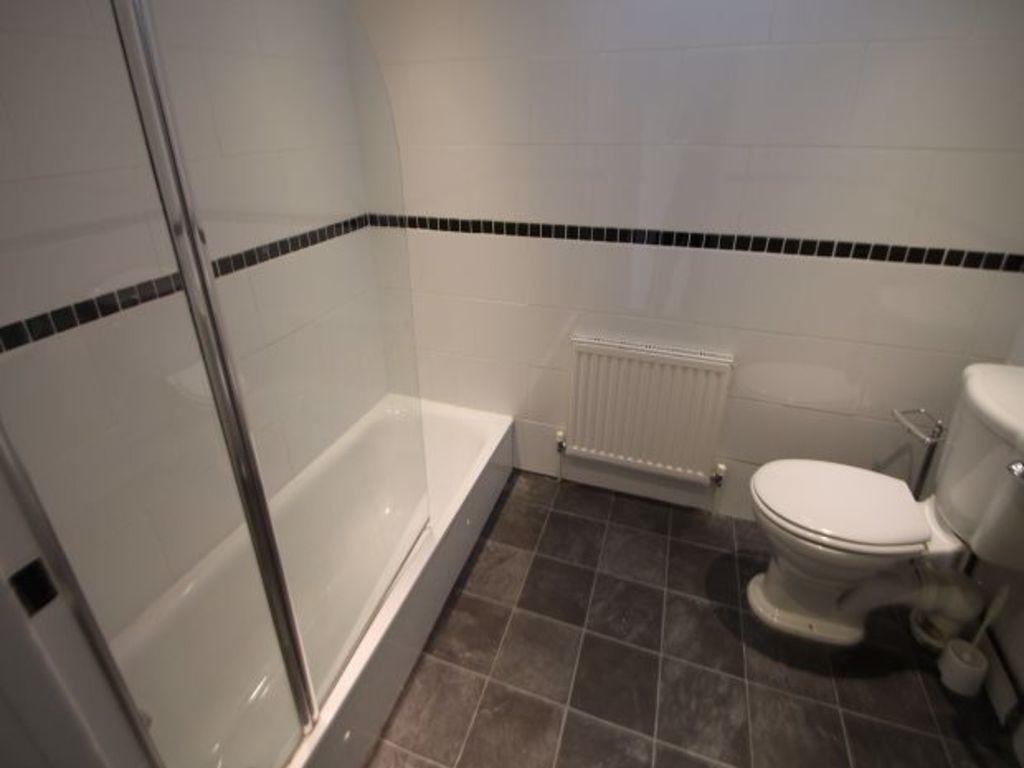 A clean and well-maintained bathroom featuring ...