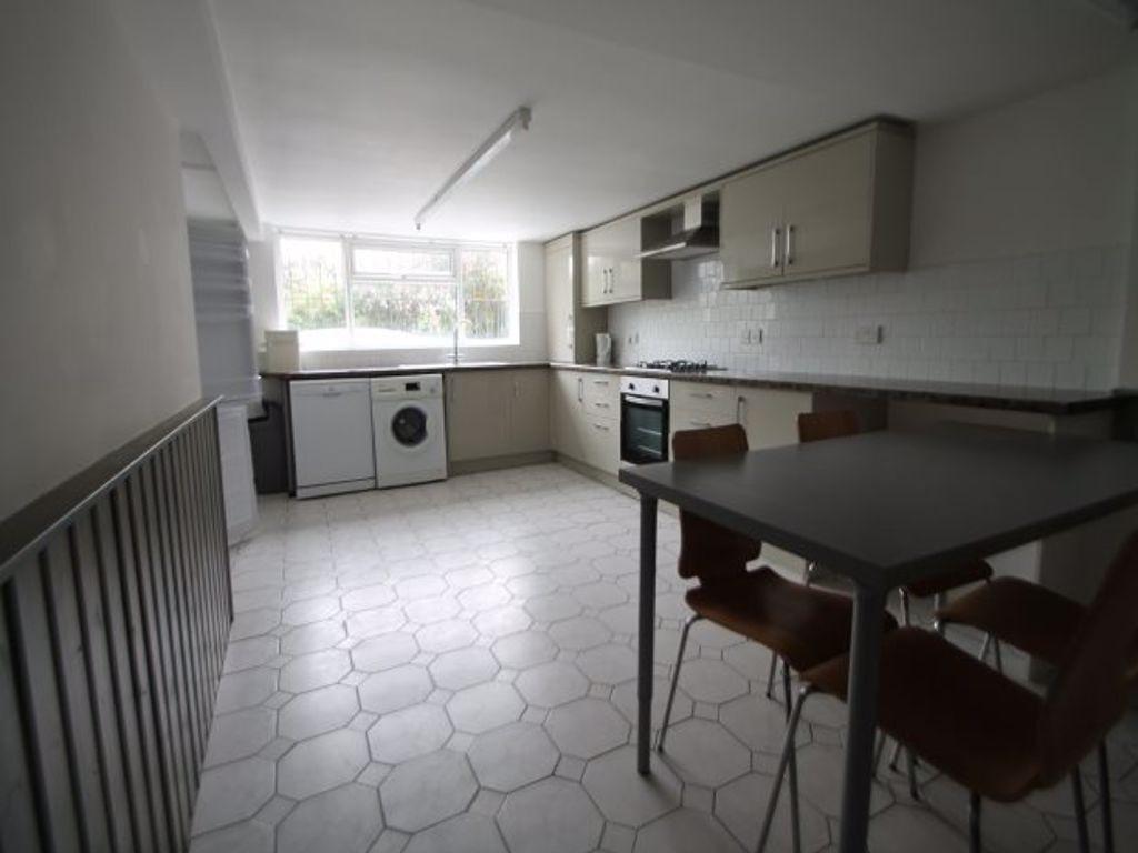 A functional kitchen with natural light coming ...