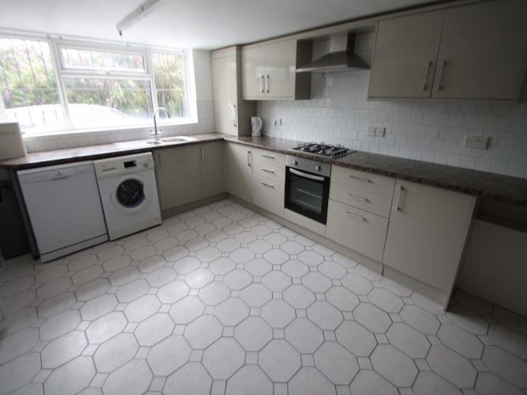Bright and modern kitchen with ample counter sp...