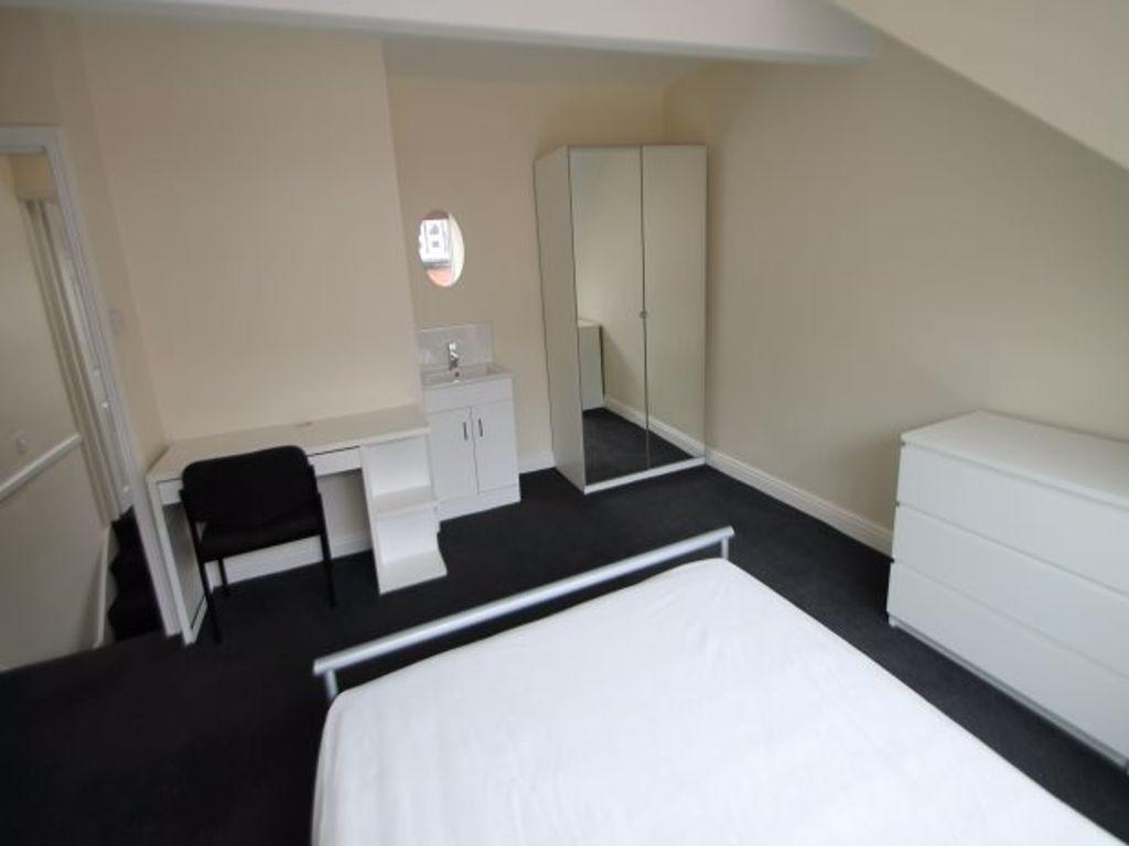 A clean and well-maintained bedroom with a comf...