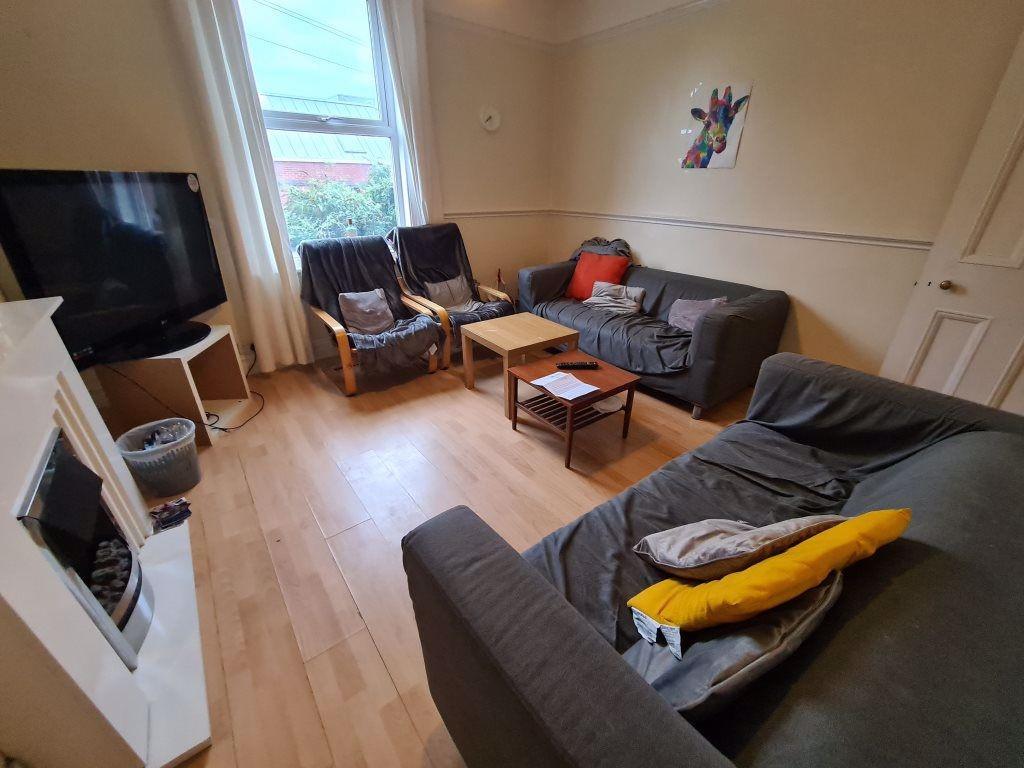 A spacious and inviting living room featuring c...