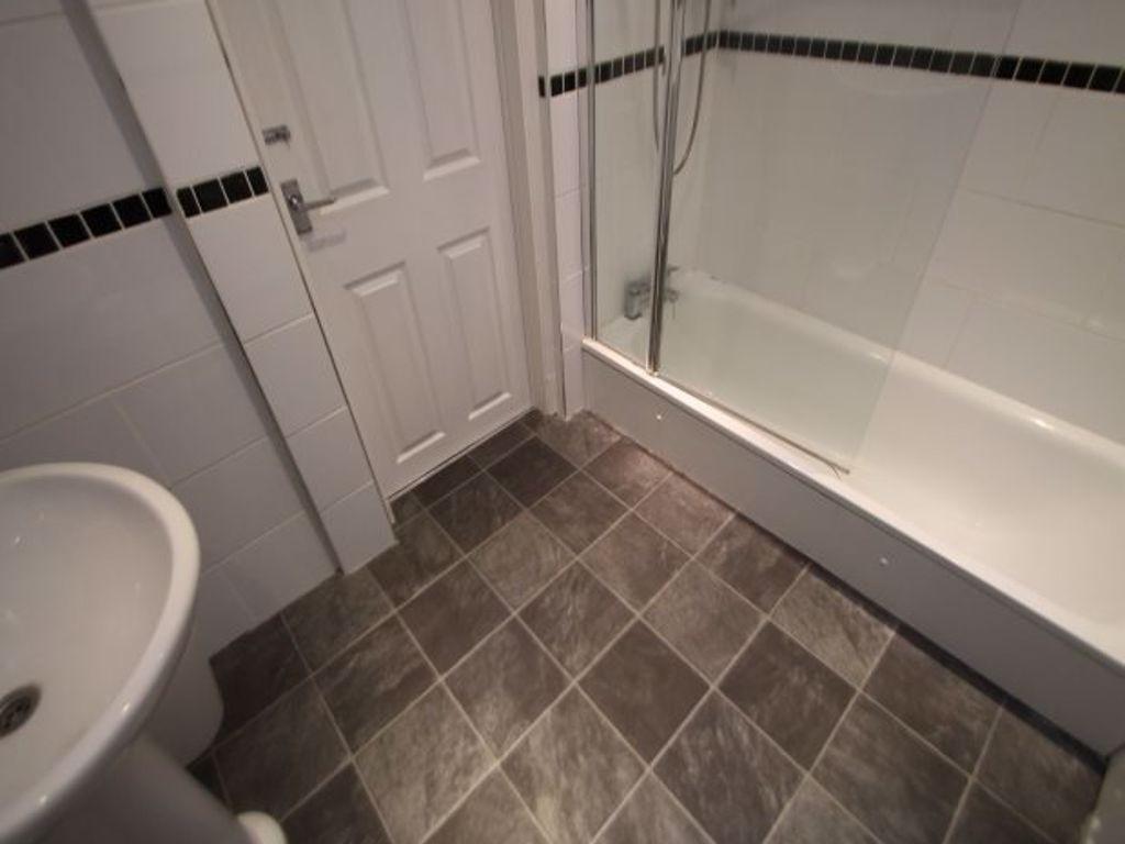 A clean, well-maintained bathroom featuring a b...