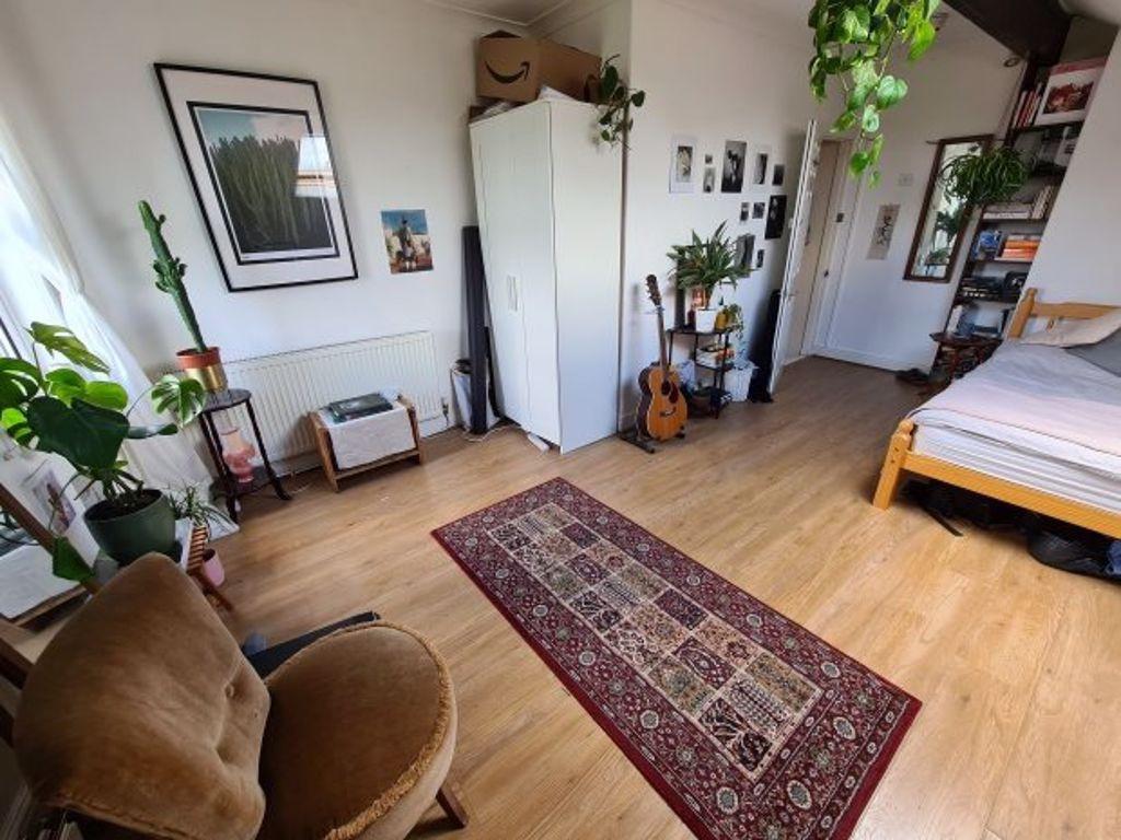A bright and welcoming living room featuring a ...
