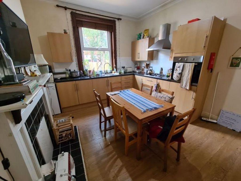 A well-lit, clean kitchen with ample counter sp...