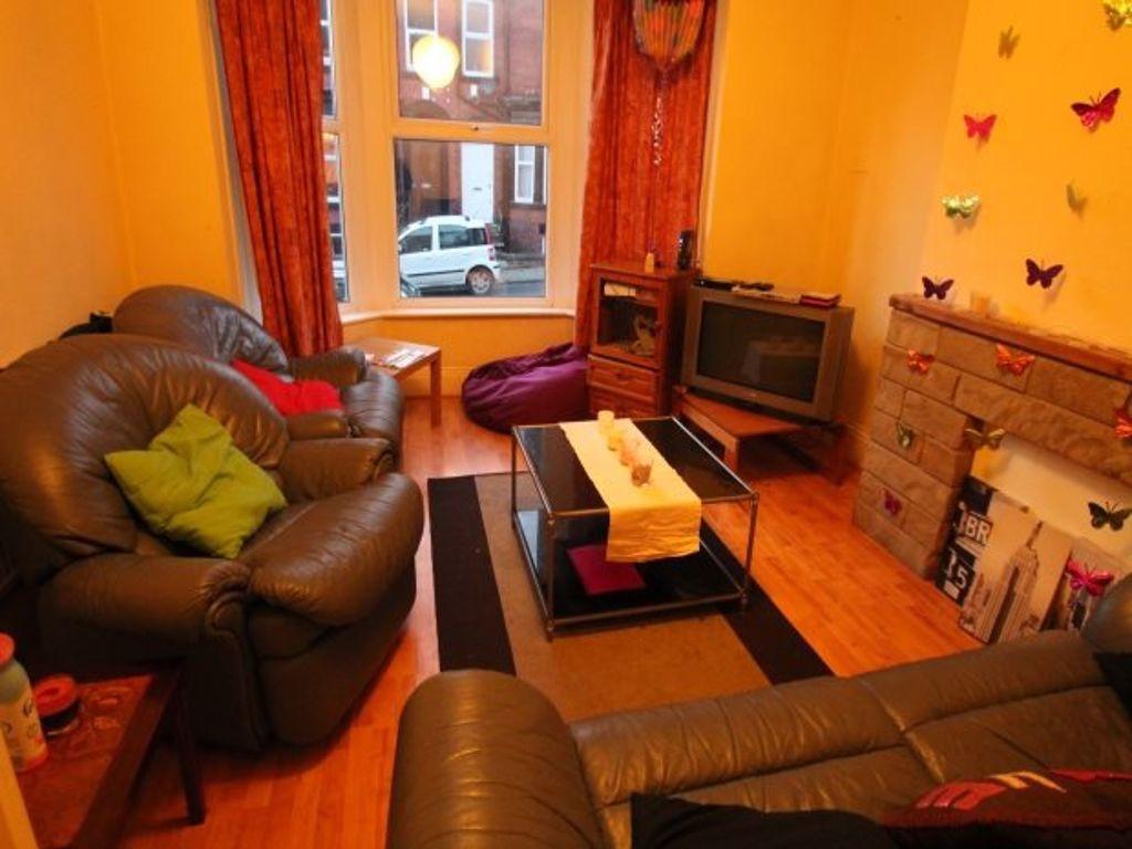 A welcoming and spacious living room with comfo...