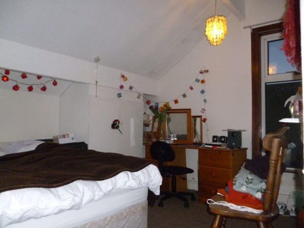 A welcoming bedroom featuring a comfortable dou...