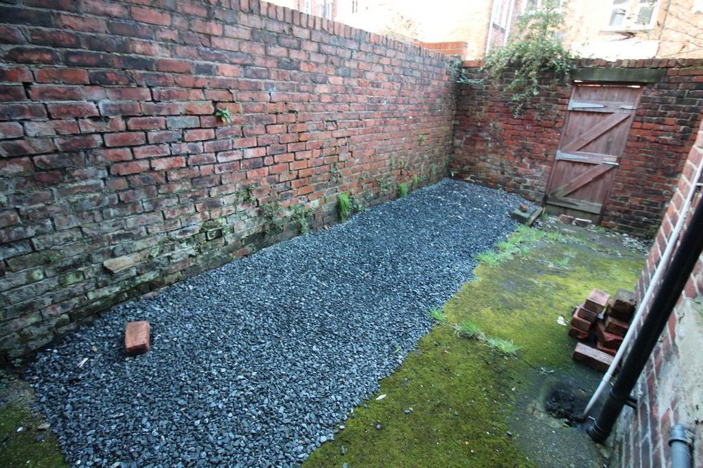 A well-maintained garden area featuring a neatl...