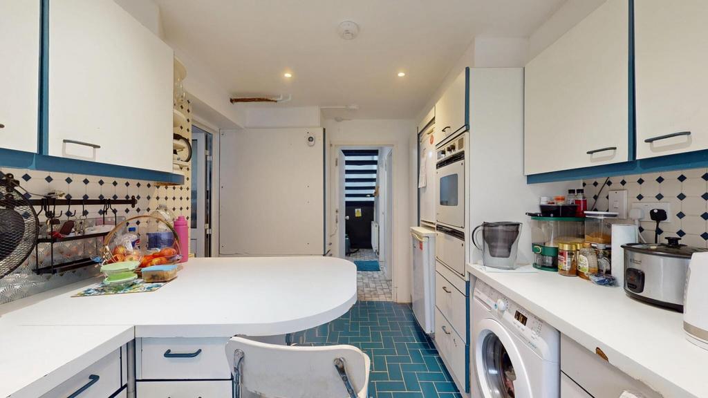 A bright, well-organized kitchen with modern ap...