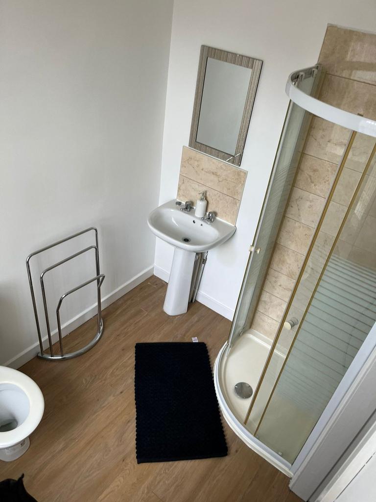 A clean and well-maintained bathroom featuring ...