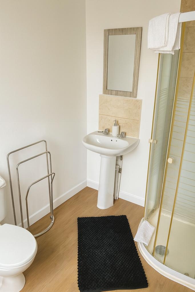 A clean and well-maintained bathroom featuring ...