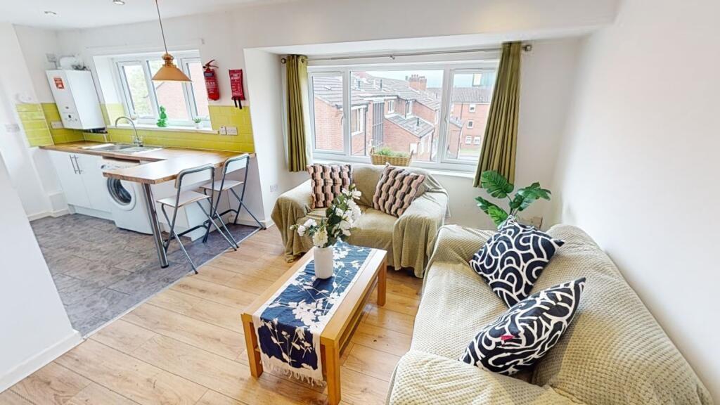 Bright and welcoming living room featuring comf...