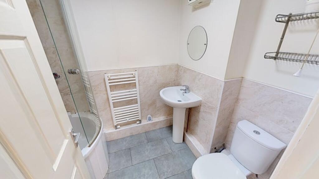 A clean and functional bathroom featuring a toi...
