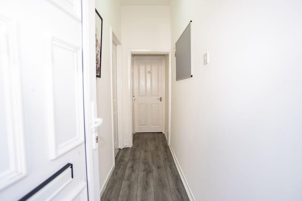 A bright, clean corridor with fresh white walls...