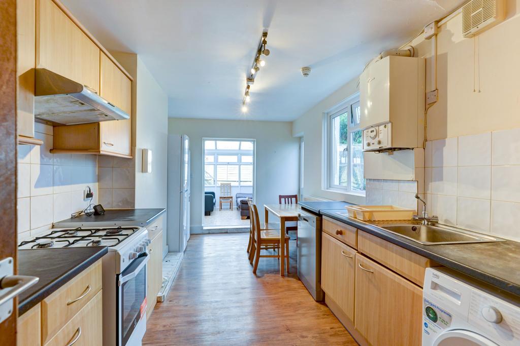 Bright galley kitchen with natural light, fitte...