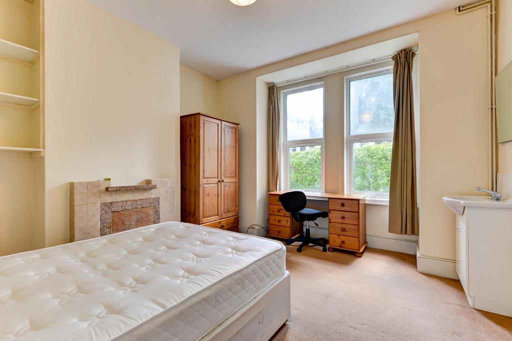 Bright and welcoming double bedroom with a comf...