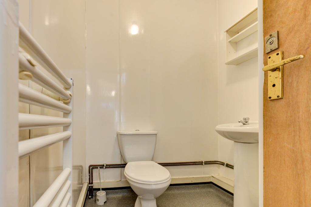 Compact, well-maintained bathroom with a modern...