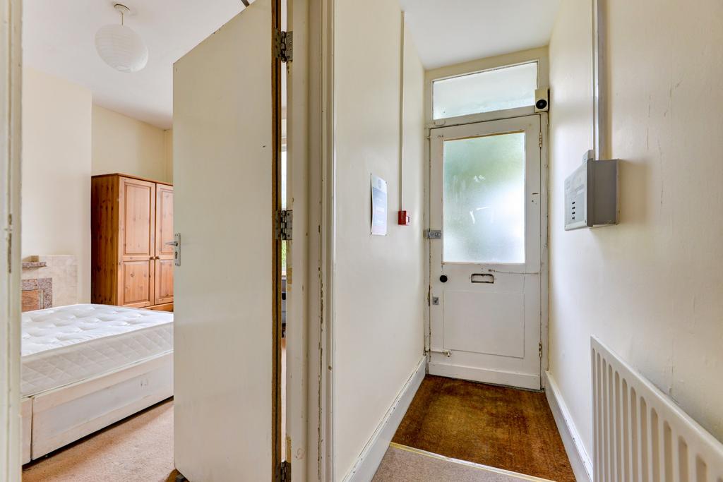 Bright, tidy entrance hallway with a frosted gl...