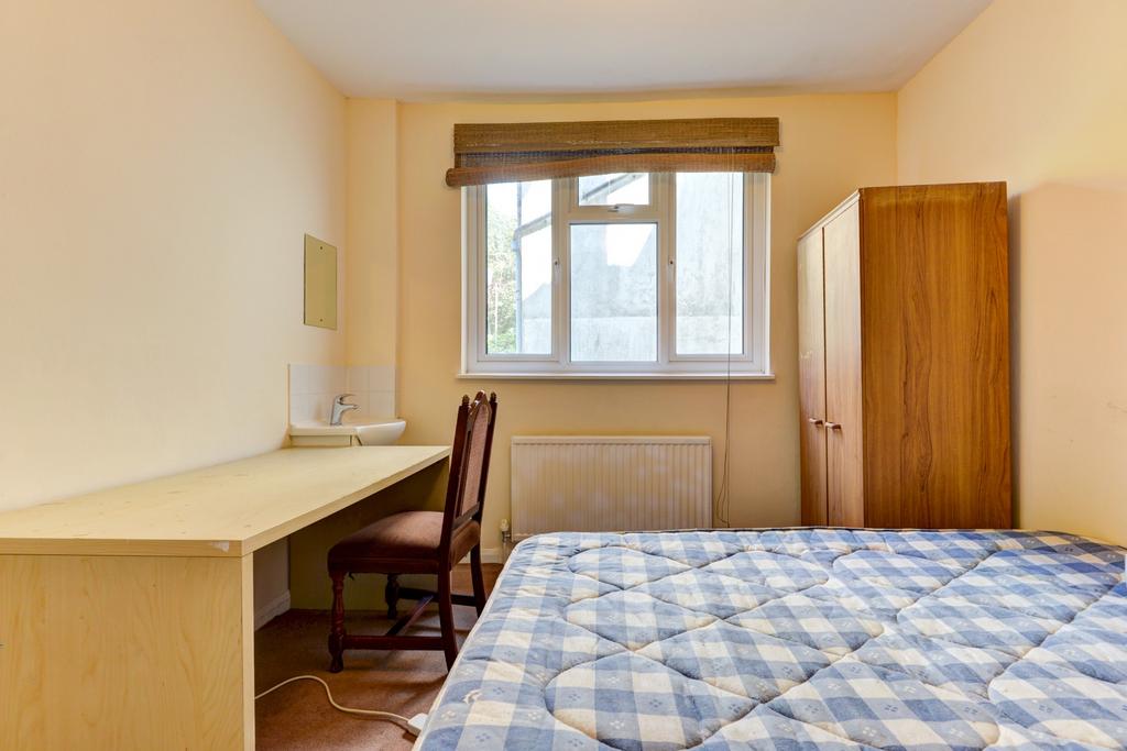 Bright, neatly presented bedroom with a double ...