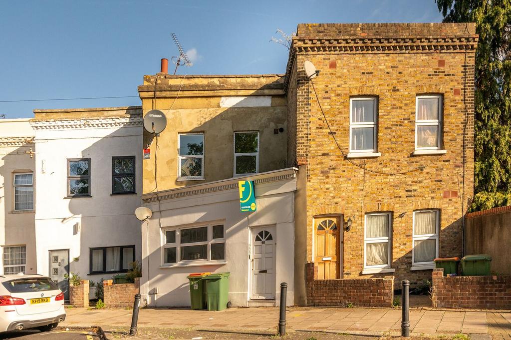 Street scene with property, parking